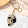 Pingente Chaveiro Caveira Cravejada de Diamantes Estilo Punk Doce e Descolado, Chaveiro de Carro e Pingente de Bolsa Moderno e Criativo