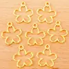 Accesorios para joyería DIY colgante de flor hueca de aleación colgante pequeño de aleación retro caliente en Europa y Estados Unidos 17 * 15 mm Q1152