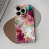 Artículo popular de comercio exterior: Funda dorada para iPhone 17 Pro con diseño floral en tonos rosa y morado acuarela, con un toque exclusivo de alta gama, diseño de película de una sola capa