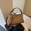 Bolsa de palha simples tecida para mulheres, novo estilo 2026, versátil, feita à mão, em formato de travesseiro, bolsa transversal de verão fashion