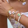 Wanxing Venta Caliente Transfronteriza Etiqueta Estampada Gota de Aceite Pulsera de Perlas Acero Inoxidable Chapado en Oro Pulsera para Mujer Joyería de Moda
