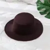 Otoño e invierno Nuevo sombrero británico para hombre sombrero de lana de copa plana estilo europeo y americano sombrero de jazz con ala sombrero para mujer venta al por mayor