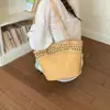 Bolso de mano texturizado de nicho transfronterizo para mujer, nuevo modelo 2026 bolso tipo cubo hueco, moderno bolso de un solo hombro para madre e hija