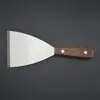 Espátula de acero inoxidable con mango de madera, ideal para asar en una plancha, raspar y untar harina, masa o crema