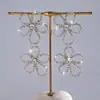 Brincos de Tarraxa com Franja Flor Vazada Inlaid com Diamante de Agulha de Prata Transfronteiriços Europeus e Americanos Brincos de Luxo Leve Estilo Corte Acessórios de Brinco Simples Modernos para Mulheres