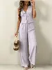 Conjunto de dos piezas estilo resort hecho a medida: Top sin mangas con cuello en V y cintura de corbata combinado con pantalones anchos fluidos