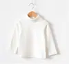 Versión coreana de camisa base de algodón cepillado de cuello alto para niños y niñas, abrigo base de algodón que no se decolora ni hace bolitas