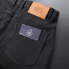 Nueva colección primavera y otoño 2026: pantalones de mezclilla para hombre, corte holgado, pierna recta, alta gama, negro puro, pantalones largos versátiles