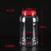 Procesamiento de envases personalizados transparentes de sólido-líquido para cintura latas de alimentos botella de plástico PET de boca ancha con asa tapa botella sellada