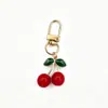 Colgante Llavero Cereza Transfronterizo Europeo y Americano, Llavero Marguerita Mariposa Pequeña, Encanto Creativo Realista Bolsa de Frutas