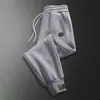 Pantalones de primavera y otoño para hombre, nuevos pantalones casuales que combinan con todo, estilo coreano, pantalones deportivos holgados de cintura moderna para hombre.