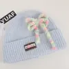 Gorro de punto estilo coreano de mezcla de lana inspirado en la dopamina con un lazo, un gorro de invierno cálido y protector para las orejas para mujer, adecuado para estudiantes