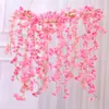 Venta al por mayor Rattan de Flor de Cerezo Simulada Enredadera Envuelta en Tubería de Aire Acondicionado Tiras de Flores Flores Falsas de Plástico Decoración de Bloqueo de Techo de Boda
