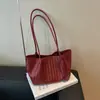 Bolsa tejida de nicho de alta gama estilo coreano, nueva de verano 2026, transfronteriza, de mano, para llevar debajo del brazo, bolso de hombro tipo tote a la moda