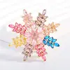 Estilo Elegante y Lujoso Colorido Broche de Copo de Nieve Diseño de Nicho Accesorios de Ramillete de Clase Lleno de Circonita Joyería de Moda