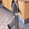 Conjunto Casual de Duas Peças com Jaqueta de Tricô com Capuz Listrada e Calça de Perna Larga Estilo Coreano Novo para Meninas Outono e Inverno 2026