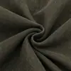 Jaqueta curta estilo militar com passantes horizontais, gola alta, lavagem desgastada, ombreiras decorativas e barra ajustável, projetada como uma peça de outer wear de trabalho.