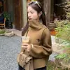 Elegante abrigo de lana irregular con botones y cuello alto estilo coreano transfronterizo para mujer, un top hermoso y moderno para otoño e invierno este año