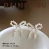 Pendientes de Aguja de Plata S925 Estilo Coreano Ins Moda Dulce Perla Ojo de Gato Lazo Pendientes Versátiles de Lujo Ligero de Gama Alta