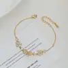 Nueva joyería de mano de lujo con circonita para mujer de verano, diseño exclusivo pulsera de lazo con piedra ojo de gato, pulsera estilo commuter