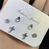 ¡Chica genial! Set de Aretes de Seis Piezas Azul Cielo Estrellado con Cruz, Diseño Único, Conjunto Versátil de Aretes Dulces y Frescos.