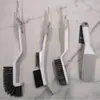 Cepillo de plástico al por mayor para el hogar, cepillo de doble cara para eliminar el polvo, artefacto multifuncional para barrer la cama, cepillo de limpieza para ropa, sofá, zapatos