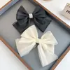 Clip de resorte con lazo de perla, accesorio para el cabello de alta gama, elegante y francés para celebridades de Internet.