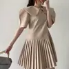 Tiro real diseño nicho chic coreano sentido de diseño temperamento estilo fragancia pequeña vestido plisado de manga abullonada con cuello de muñeca para mujer