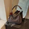 Bolsa feminina de grande capacidade transfronteiriça 2026 nova bolsa transversal estilo nicho para estudantes universitários bolsa de ombro bolsa tote para o dia a dia