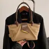 Bolsa de Mão de Luxo de Nicho para Mulheres 2026 Nova Moda Estilo Coreano Bolsa Saco Plissada Versátil para o Dia a Dia Transversal