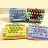 Nuevo producto creativo y lindo: llavero de juguete con botón antiestrés de 26 teclas, accesorio colgante para bolsa de niños, diversión sin parar