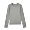 Camiseta de manga larga con cuello redondo, mezcla de lana merino y Tencel de 220 g/m², corte ajustado, básica, simple y versátil para usar debajo de otras prendas.