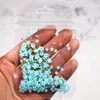 Arte de uñas flor de cinco pétalos joyería flor blanca pequeña bolsa mixta de tamaño de cuentas doradas y plateadas decoración de pegatina de uña de flor de resina venta al por mayor