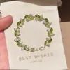 Pulseira two-tone verde-oliva e com diamantes brancos O Mágico de Oz para mulheres, novo acessório de pulso da moda primavera/verão, pequena mercadoria para bancas