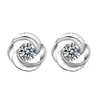 Pendientes de plata de ley S999 para mujer con diamante giratorio de moda, versión coreana de pendientes retro de diamante y rosa, fabricantes de pendientes al por mayor