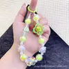 Celebridad de Internet Moda Trébol de Cuatro Hojas Color Bolas Bolso Accesorios Colgante Cadena para Teléfono Móvil Super Hada Cristal Colgante Colgante de Bolas