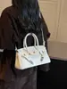 Bolsos retro europeos y americanos para mujer, nuevo bolso de moda Kelly transfronterizo Otoño 2026, bolso cruzado de alta gama, bolso platino