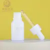 Botella de porcelana blanca de 35 g para aceites esenciales de alta apariencia en stock, botella dispensadora de sérum a prueba de luz con gotero de punta de goma, botella cosmética portátil