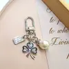 Nuevo de Moda Venta Caliente Transfronteriza Estilo Coreano Flor de Cinco Pétalos Niña Flor de Pera Colgante Llavero Accesorio Decoración para Bolsa Zouju