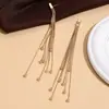 Venta Caliente Transfronteriza Temperamento Cinco Bolas de Acero Cadena Hueso de Serpiente Temperamento Lujo Ligero Aretes con Borla Aretes de Bolas de Acero Color Cobre Dorado para Mujer