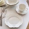 Venta al por mayor exportación comercio exterior palacio retro luz de lujo repujado cerámica tazón para pastelería taza de café plato