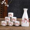 Fabricantes al por mayor de juego de vino de porcelana blanca creativo, copa de vino de cerámica para el hogar, exquisita caja de regalo con regalo de mano