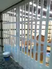 Centro comercial Puerta plegable de cristal Riel colgante Sin perforaciones Sin riel inferior Barrera para coche Puerta de persiana de intervalo Tienda de belleza Tienda de lavado de coches