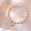 Pulseira de pérola de água doce natural feminina popular online design de nicho ins japonês e coreano pulseira de concha joia de mão para namoradas atacado