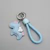 Llavero Hazte Rico Inmediatamente Cuerda Trenzada de Cuero de Moda Llavero de Coche Lindo de Dibujos Animados Colgante de Pony para Bolso