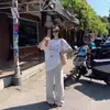 Camiseta de Algodão Puro com Manga Curta Estilo Retrô Americano Personalizada com Grafite para Mulheres Verão Tendência Marca Solta Visual Emagrecedor Estilo College Top de Manga Meia