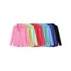 Ropa de mujer transfronteriza al por mayor 2026 nueva moda casual versátil color liso con botones manga larga cuello camisero top
