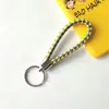Llavero creativo llavero de cuerda de cuero cordón para llaves colgante de joyería cordón tejido fábrica de cuerda de cuero venta al por mayor