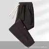 Pantalones casuales de otoño transfronterizos para hombre, corte holgado extragrande, estilo jogger versátil, cómodos para el trabajo y el deporte, pantalones largos