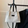 Bolso de Hombro Casual de Primavera de Gran Capacidad 2025 Nuevo Moda Casual Color Sólido Bolso de Axila para Viajero Bolso Tote de Color Contrastante